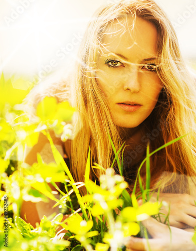Photo: Beautiful blonde woman on grass Beautiful blonde woman on grass