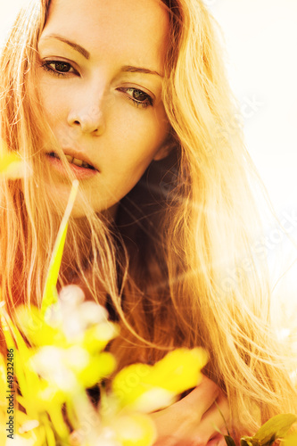 Photo: Beautiful blonde woman on grass Beautiful blonde woman on grass