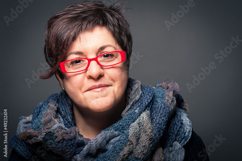 Photo: Middle age woman with red glasses close up portrait Middle age woman with red glasses close up portrait