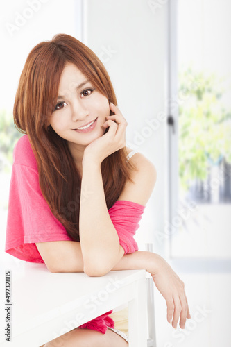 Photo: smiling young beautiful asian woman smiling young beautiful asian woman
