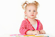 Foto: Little girl draws, on a gray background Little girl draws, on a gray background