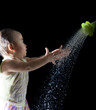 Photo: file of face of asian baby playing with water on black backgroun file of face of asian baby playing with water on black backgroun
