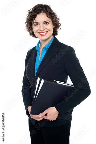 Photo: Attractive corporate lady with files in hand Attractive corporate lady with files in hand