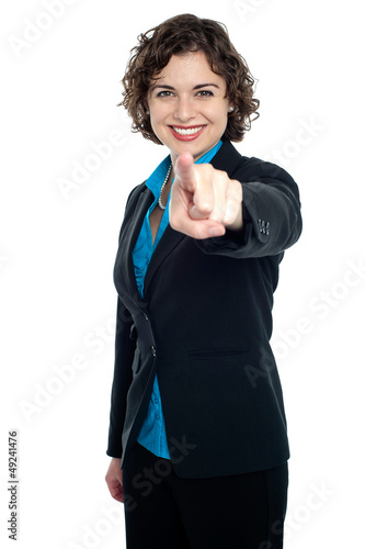 Photo: Joyous corporate woman pointing you out Joyous corporate woman pointing you out