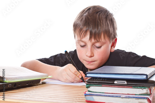 Photo: schoolchild learns lessons schoolchild learns lessons
