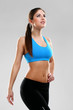 Young beautiful woman in fitness wear