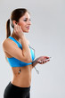 Young woman in fitness wear with headphones