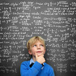 Photo: Schoolboy at the Blackboard with Formulas Schoolboy at the Blackboard with Formulas