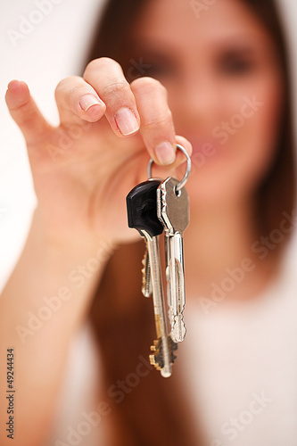 Photo: Beautiful woman holds keys Beautiful woman holds keys