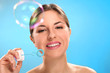 Natural caucasian woman with bubble blower