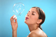 Natural caucasian woman with bubble blower