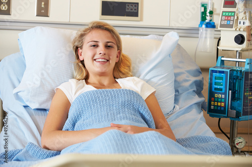 Photo: Teenage Female Patient Relaxing In Hospital Bed Teenage Female Patient Relaxing In Hospital Bed