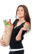 Photo: Woman holding a shopping bag full of groceries and mango Woman holding a shopping bag full of groceries and mango