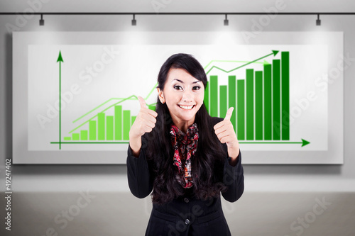 Photo: Successful business woman with bar chart Successful business woman with bar chart