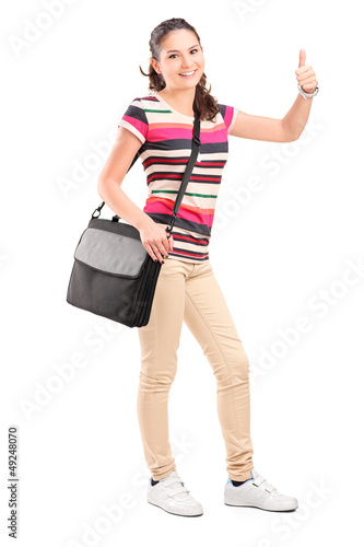 Photo: Female college student with a shoulder bag giving a thumb up Female college student with a shoulder bag giving a thumb up