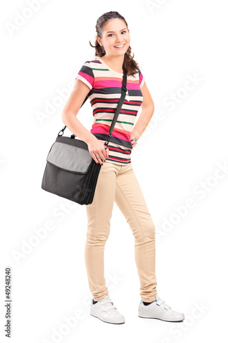 Photo: Full length portrait of a female college student with a shoulder Full length portrait of a female college student with a shoulder