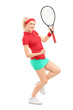 Full length portrait of a happy female tennis player