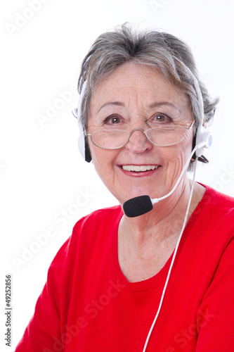 Photo: Portrait - ältere Frau mit Headset isoliert Portrait - ältere Frau mit Headset isoliert