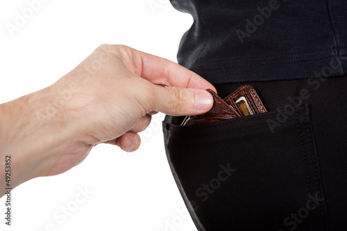 Photo: Pickpocket stealing a mans wallet Pickpocket stealing a mans wallet
