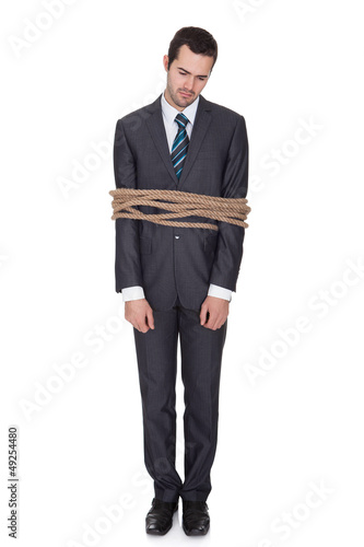 Photo: Businessman tied up in rope Businessman tied up in rope