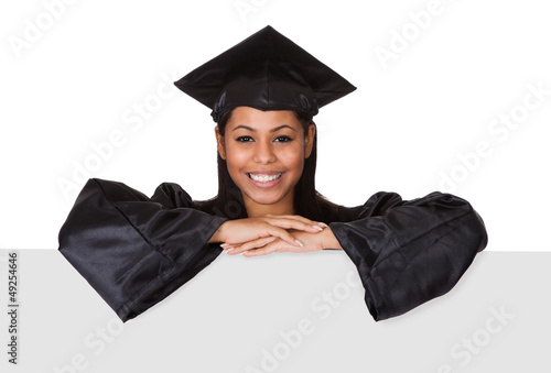 Photo: Graduate Woman Holding Placard Graduate Woman Holding Placard
