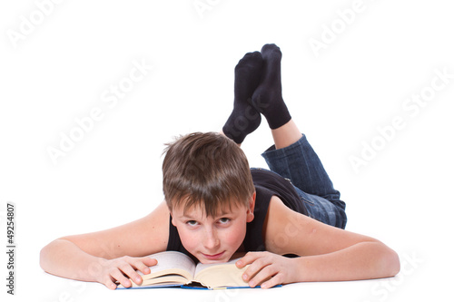 Photo: boy reading a book boy reading a book