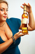 Sexy young woman with bottle of rum