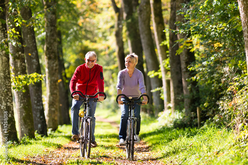 Photo: Seniors exercising with bicycle Seniors exercising with bicycle
