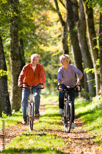 Photo: Seniors exercising with bicycle Seniors exercising with bicycle