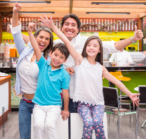 Photo: Excited family at a cafeteria Excited family at a cafeteria