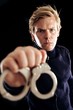 Police Officer with Handcuffs Taking Criminals to Jail