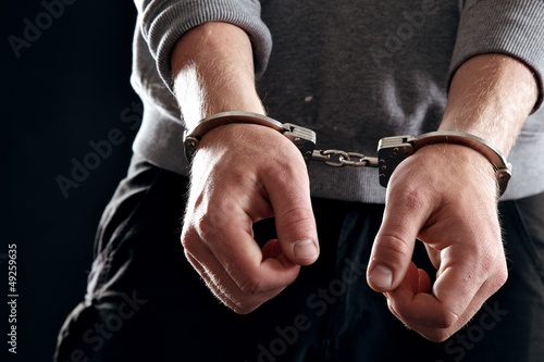 Photo: Handcuffed Man Handcuffed Man