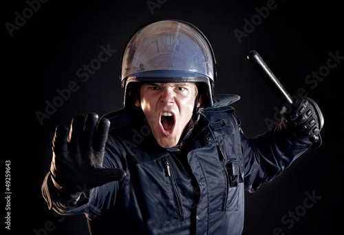 Photo: Angry Police Officer Telling Violent Crowd to Stop Angry Police Officer Telling Violent Crowd to Stop