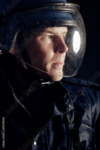 Photo: Riot Policeman with a Helmet Riot Policeman with a Helmet