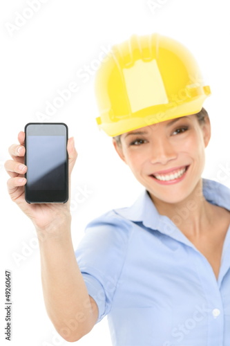 Photo: Engineer or architect woman showing smart phone Engineer or architect woman showing smart phone