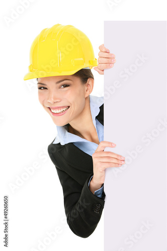 Photo: Engineer entrepreneur business woman showing sign Engineer entrepreneur business woman showing sign