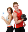 Photo: Athletic woman and man with a dumbells. isolated on white Athletic woman and man with a dumbells. isolated on white