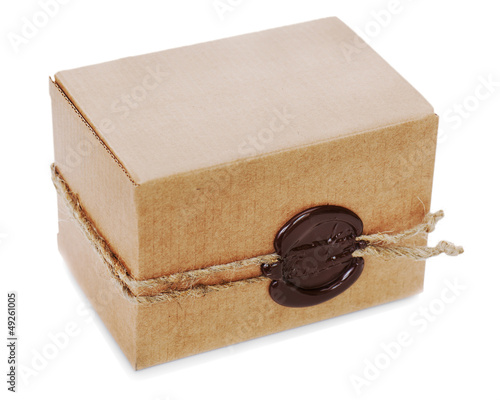 Photo: cardboard box with stamp isolated on white background cardboard box with stamp isolated on white background