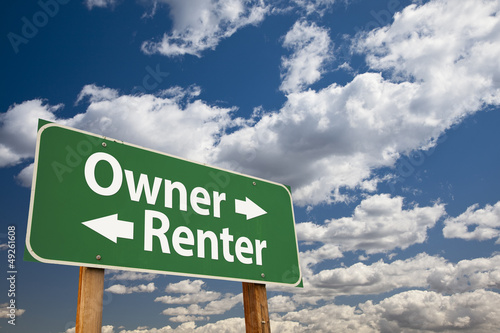Photo: Owner, Renter Green Road Sign Over Clouds Owner, Renter Green Road Sign Over Clouds