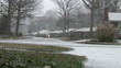Snowfall in a residential neighborhood.