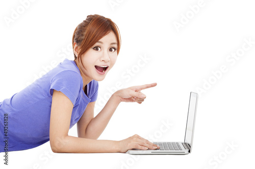 Photo: surprised young woman with laptop surprised young woman with laptop