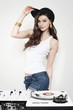 Beautiful young woman with white turntable and mixer