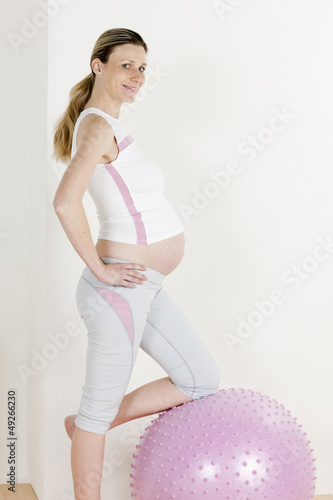 Photo: pregnant woman doing exercises pregnant woman doing exercises