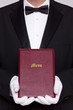 Waiter holding a Menu