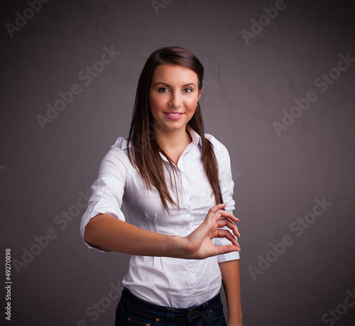 Photo: Pretty girl holding something Pretty girl holding something