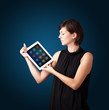 woman holding modern tablet with colorful icons