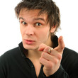 Portrait of young man showing finger