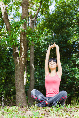 Photo: attractive asian woman relaxing in the park attractive asian woman relaxing in the park