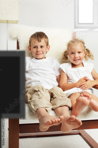 Photo: Children watching TV Children watching TV