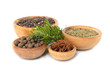 Spices in a wooden bowl on a white background